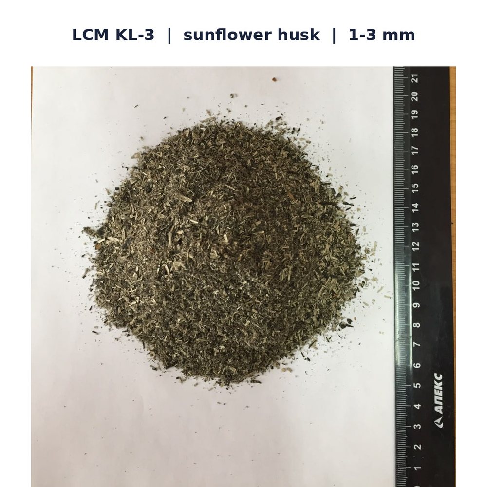 BPMD LCM grade KL-3 from sunflower husk, particle size 1 to 3 mm, with ruler for scale